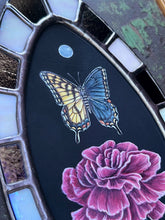 Load image into Gallery viewer, Close up- shows in order painted pearl, bilateral gynandromorph swallowtail and pink/red carnation flower. Oval border shows bronze and white checker
