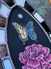 Load image into Gallery viewer, Close up- shows in order painted pearl, bilateral gynandromorph swallowtail and pink/red carnation flower. Oval border shows bronze and white checker