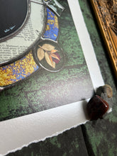 Load image into Gallery viewer, Bottom left of print shows rosebud in outer circle , bottom right of piece - Luna moth medallion print. Luna moth is in central circle on black background with segmented border of vintage book pages. Third and outermost rung is gold mirror with bronze flecks, pressed wildflowers, and glass bevels in alternating border. 12x12" reproduction giclée print of Vintage Luna with a 1.25" deckled edge border
