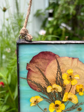 Load image into Gallery viewer, Close up - Spring buttercups, rose petals, lace leaf maple with dark wispy green/blue glass backing
