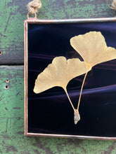 Load image into Gallery viewer, Slight close up - Single golden yellow gingko leaf with dark wispy purple/dark maroon glass backing
