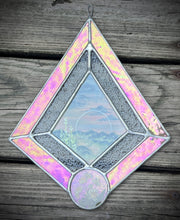 Load image into Gallery viewer, Refraction.  Gouache landscape set between glass with pressed wildflowers. Iridescent pink and textured clear glass border.
