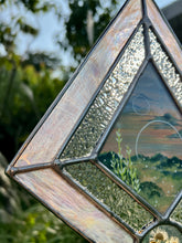 Load image into Gallery viewer, Close up. Gouache landscape set between glass with pressed wildflowers. Iridescent pink and textured clear glass border.
