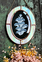 Load image into Gallery viewer, Blue oyster mushroom gouache painting on black. Oval shaped glass hanging wall art with oval rainbow iridized glass border and chain
