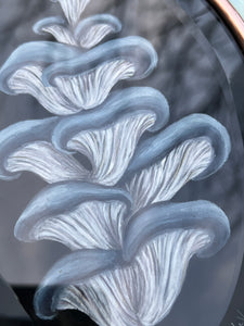 Close up of painted center of artwork. Showing blue and white-gilled oyster mushroom painted on black