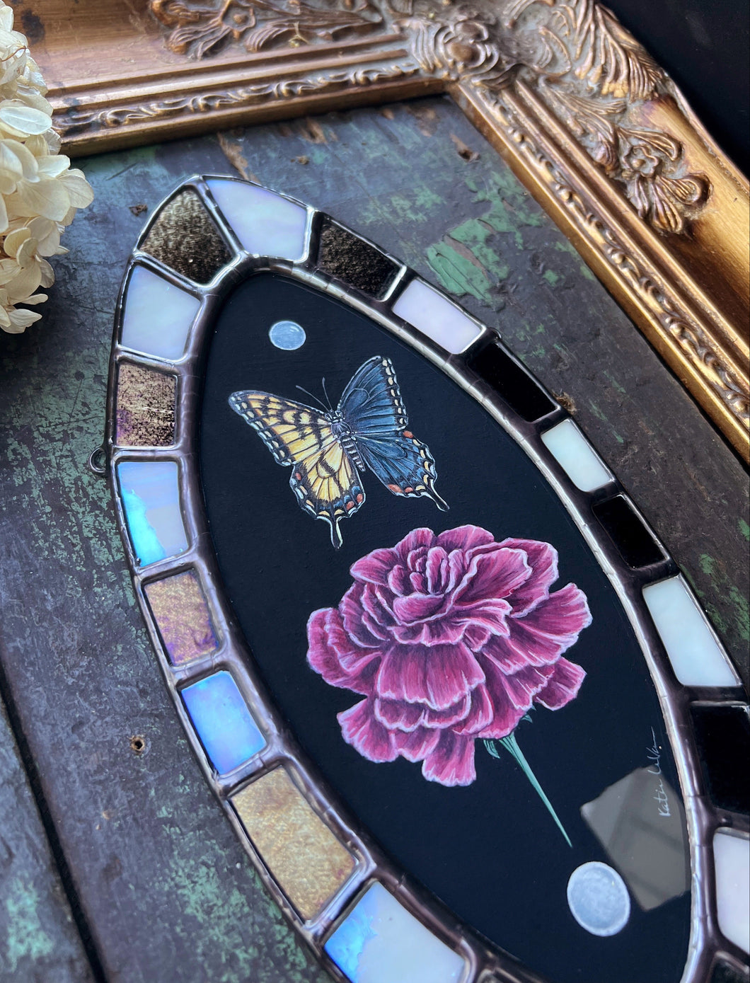 Full photo- bilateral gynandromorph swallowtail with pink carnations gouache painting encased in glass with bronze/black and white/opal checkered border.