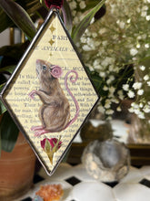 Load image into Gallery viewer, Painted brown mouse and golden stars. Diamond shape. Gouache and gilding paint on vintage book page in beveled glass.
