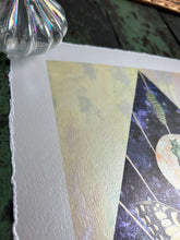 Load image into Gallery viewer, Left side of piece showing deckled edge border - Swallowtail Life cycle depicts full grown swallowtail, larvae, and cocoon in vertical row. Blue/purple and metallic hand dyed background in geometrical shape (pointed top, angled sides, flat bottom). Artwork is on yellow iridescent glass to mimic original piece. 8x10&quot; reproduction giclée print of Swallowtail Life Cycle with a 1.25&quot; deckled edge border

